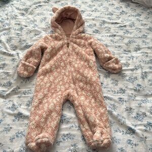 This winter fleece hooded footie is more blush and white color than pictures.